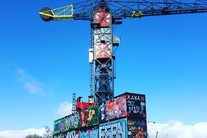 Amsterdam's Hidden Gems and Street Art Bike Tour - Finishing with Amsterdam Central Station by ferry and cycling culture talk