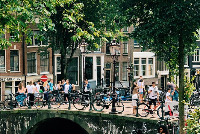 Amsterdam's Unexpected Treasures Private Walking Tour - St. Nicholas Basilica area, canals, and stories from the Golden Age