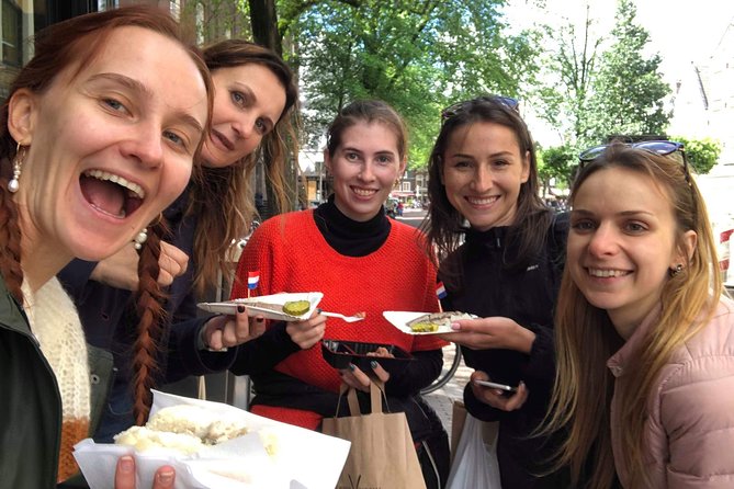 Amsterdam's Unexpected Treasures Private Walking Tour - Begijnhof, humpback bridge views, chapels, and calm courtyards