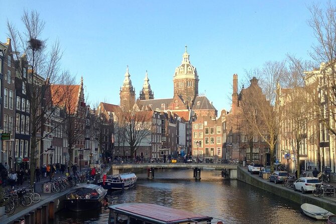 Amsterdam Sightseeing Tour + Hidden Gems + Tastings + PDF guide - Bloemenmarkt and Munttoren: flowers with symbolism and money history