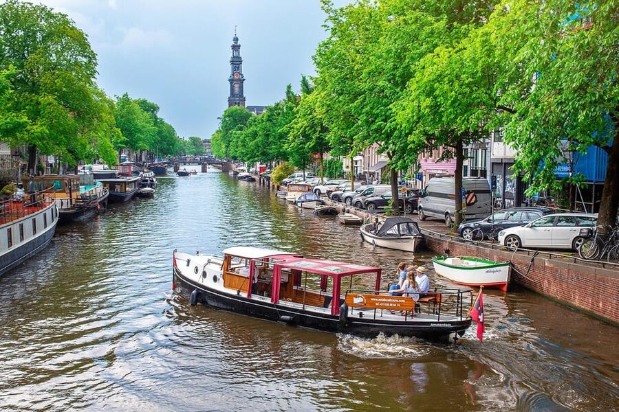 Amsterdam: Small-Group Canal Cruise incl. Drinks and Snacks - Meet Giuliana: inside and outside comfort, plus a toilet