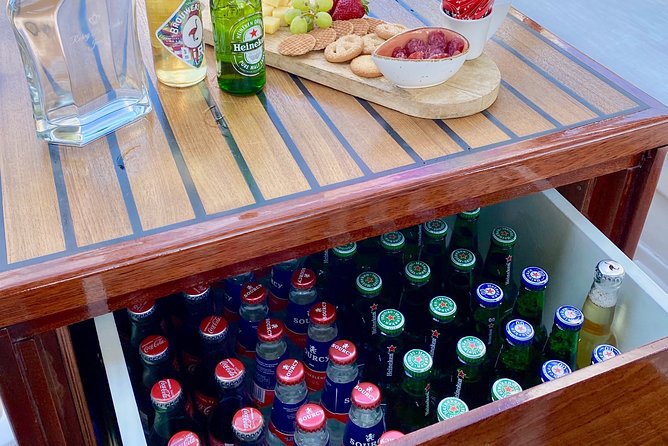 Amsterdam Small-Group Canal Cruise Including Snacks and Drinks - The maritime and botanical passes: National Maritime Museum area, an East Indiaman ship, and Hortus Botanicus