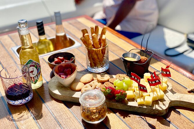 Amsterdam Small-Group Canal Cruise Including Snacks and Drinks - Comfort on the water: open visibility, chilly months, and staying dry when you can