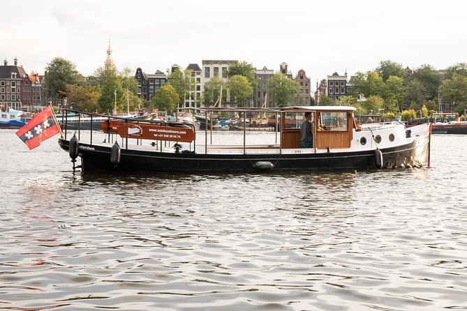 Amsterdam Small-Group Canal Cruise With Dutch Snacks and Drink - Max 10 on a Small Boat Means You Can Actually Talk With the Captain