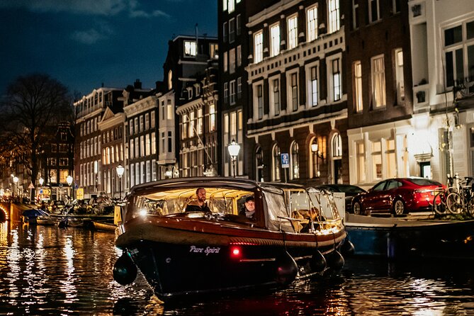 Amsterdam Small-Group Evening Canal Cruise Including Wine, Craft Beer, Cheese - Landmark parade: Anne Frank House area, Skinny Bridge, Amstel, 7 Bridges, de Wallen