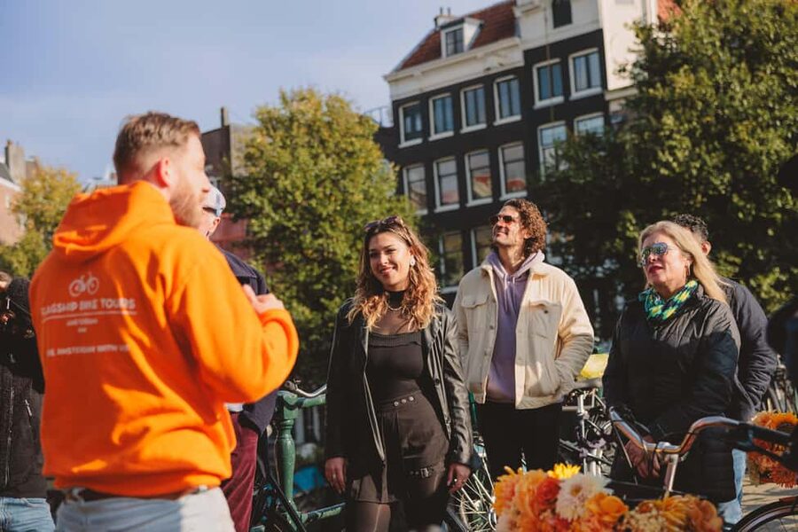 Amsterdam: Top Highlights Guided Bike Tour - Anne Frank House and the tallest church next door: handling a powerful stop on a bike tour