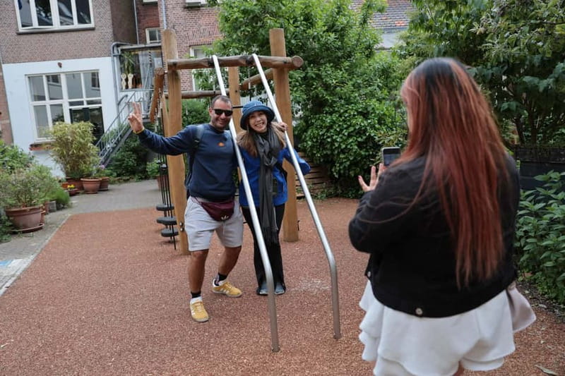 Amsterdam Walking Tour:Anne Frank, History & Liberal Culture - When canals turn into stories: leaning houses and houseboat life
