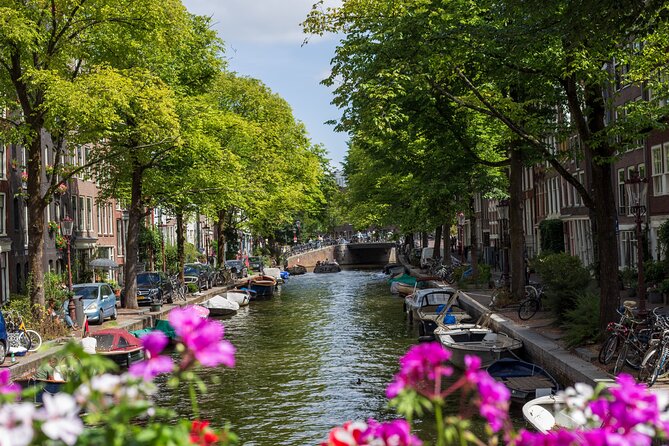 Amsterdam Walking Tour: Urban Legends & History with local guide - Stop 1, The Amstel: canalside legends start the story engine