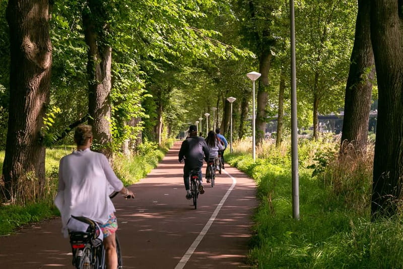 Amsterdam: Windmill, Cheese, and Countryside E-Bike Tour - Meeting Point, Ferry Start, and the First Amsterdam Views