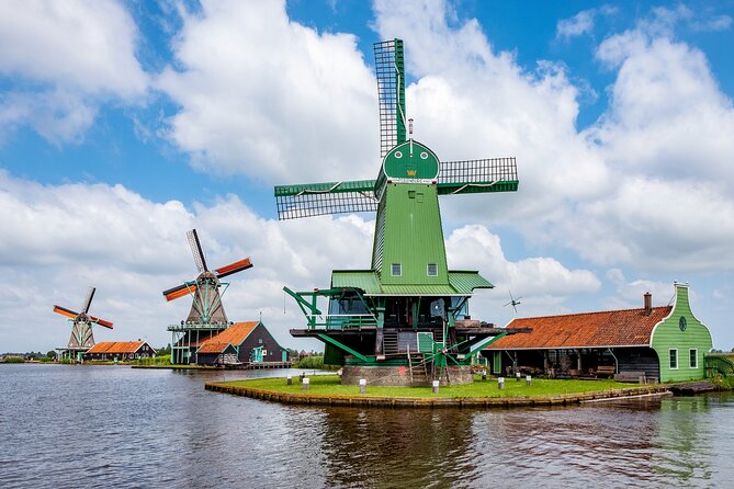 Amsterdam: Windmills, Cheese and Volendam Tour with Video Guide - Volendam: Waterfront Strolls, Food Stops, and Optional Costume Fun