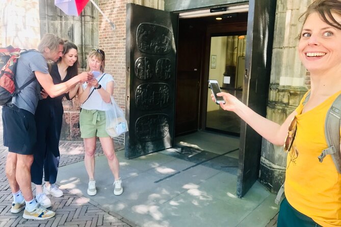 Discover Amsterdam's city center in this Outside Escape game tour - Stop 3, Munttoren: the tower of coins and a lively square moment
