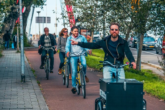 Discover Rotterdam: Classic Highlights Bike Tour with a Local - Stop 1: Hotel New York and the migration museum view
