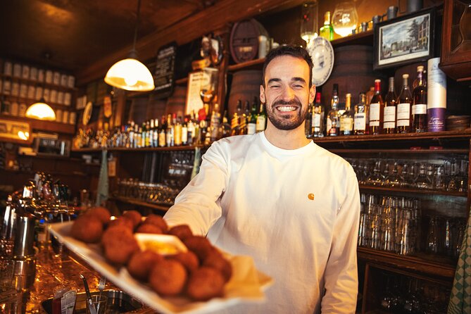 Eating Amsterdam: Albert Cuyp Market & The Pijp Food Tour - Simon Meijssen saucijzenbroodje: the Dutch snack you can taste with your hands