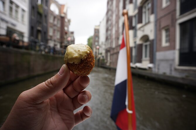 Eating Amsterdam: Food Tour & Canals Cruise - Fishmonger stop: herring and kibbeling the real way