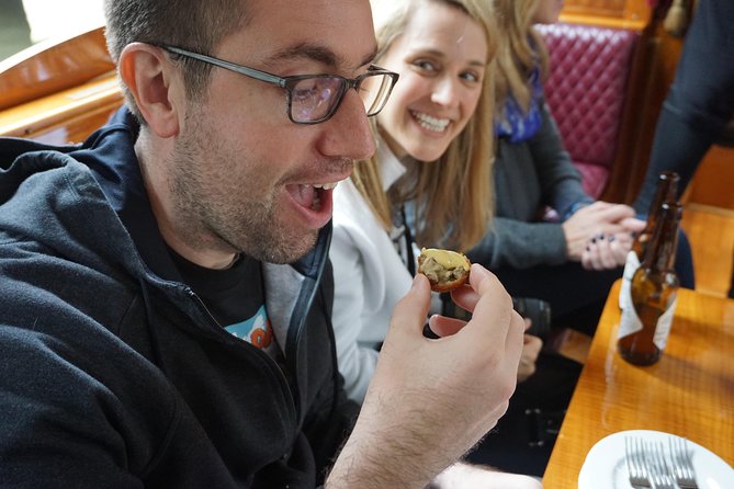 Eating Amsterdam: Food Tour & Canals Cruise - Canal-side walking: Golden Age architecture and street-level stories