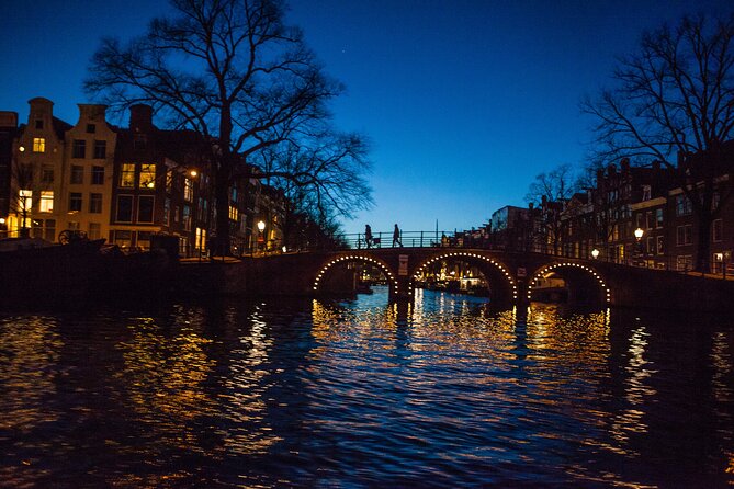 Evening Canal Cruise in Amsterdam with Wine & Cheese Option - Amstel River moments: the skinny bridge and a front-row look at the riverfront