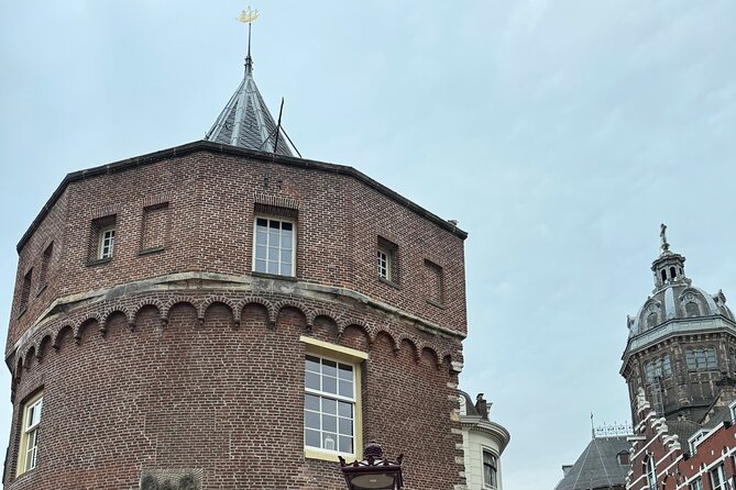 Ghost Walking Tour and Dark History in Amsterdam - Dam Square after dark: witch trials, WWII violence, and hauntings