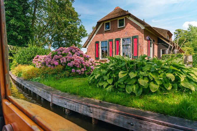 Giethoorn Day Trip from Amsterdam with Boat Trip - The dike stop: Afsluitdijk as a quick education or time pressure