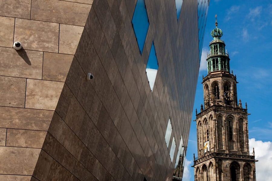 Groningen: Walking Tour with Local Guide - A-church yellow tower and stepping back about 800 years