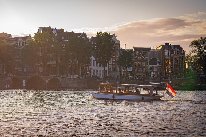 Private Boat Tour Amsterdam - 90 Min incl. welcome drink on historic saloon boat - Welcome drink, bottled water, and the minibar you control