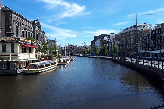 Private Tour: Amsterdam City Walking Tour and Canal Cruise - The Lovers Canal Cruises boat ride: glass roof, classic views, UNESCO context