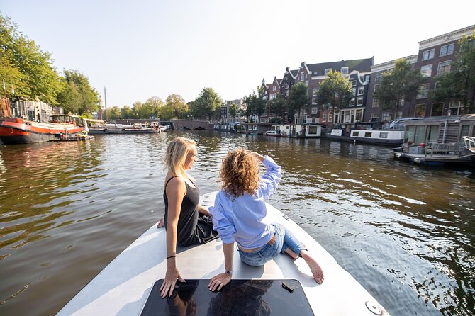Small Group Boutique All-Inclusive Tour (max 12 p) With Captain - Stop-by-stop: Jordaan, maritime warehouses, and a clock tower on the defense wall
