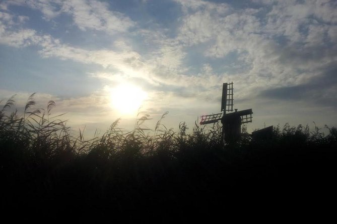 Small-Group Guided Sunset Canoe Tour in Waterland with Dinner - Windmills in view and dinner on a lake island