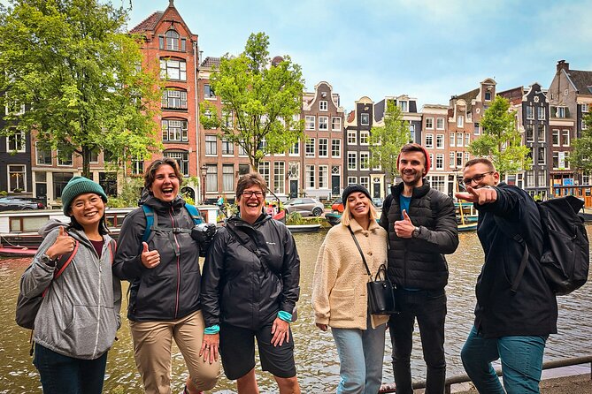 Small Group Walking Tour - Hello Amsterdam - Damrak near the Red Light District: learning through a true-or-false game