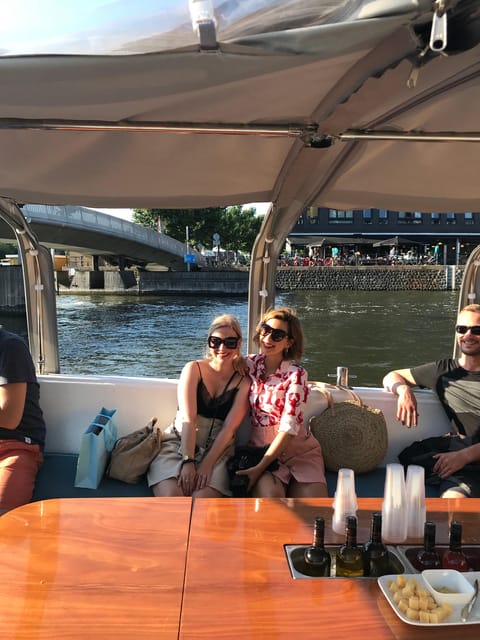 Visit Amsterdam by Boat with a French Guide (french) - Dutch apéro on board: cheese tasting, included drinks, and smart extras